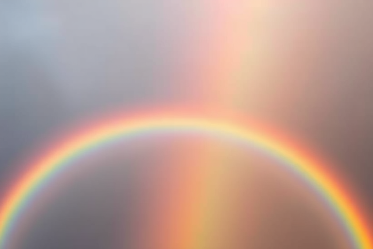 Create an image of a vibrant rainbow with smooth gradient arcs, utilizing a high-resolution digital camera, with an aperture of f/8, ISO 100, and a lens focal length of 50mm, shot from a frontal view with even lighting to enhance color saturation and detail.
