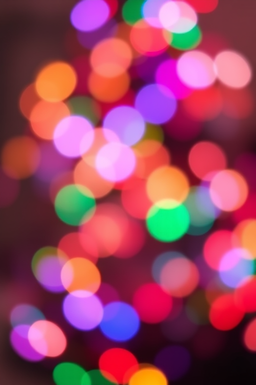 Generate an image of a softly blurred background filled with colorful, out-of-focus lights resembling a festive atmosphere. The lights should be in various shades of warm and cool colors, creating a bokeh effect that evokes a cozy and cheerful ambiance.