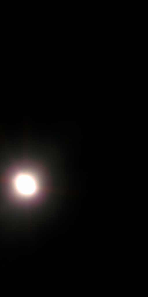 Generate a high-resolution image of a bright light shining against a dark background, using a DSLR camera with an aperture of f/2.8, shutter speed of 1/60 sec, ISO 100, in a wide-angle view, captured in landscape orientation with soft focus and lens flare effects.