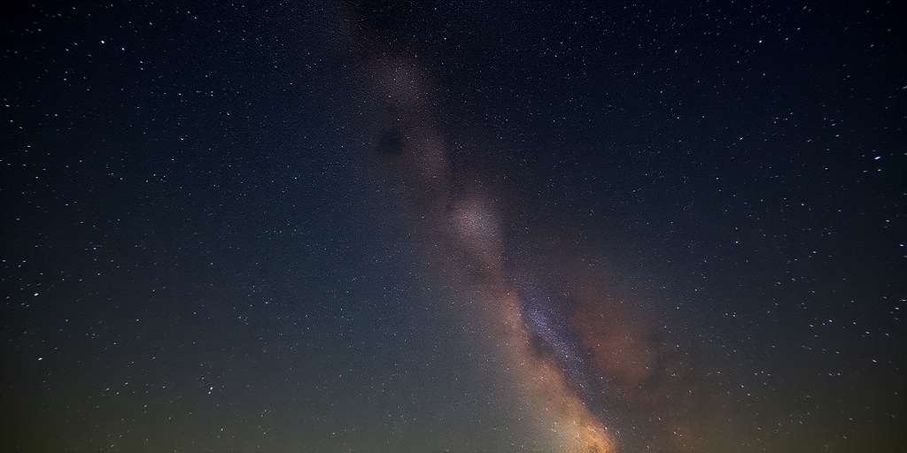 Astrophotography of the Milky Way galaxy in a clear night sky, using a DSLR camera with a 24mm lens, f/2.8 aperture, 20-second exposure, ISO 3200, taken from a high vantage point with minimal light pollution, captured in landscape orientation to emphasize the vastness of the cosmos.