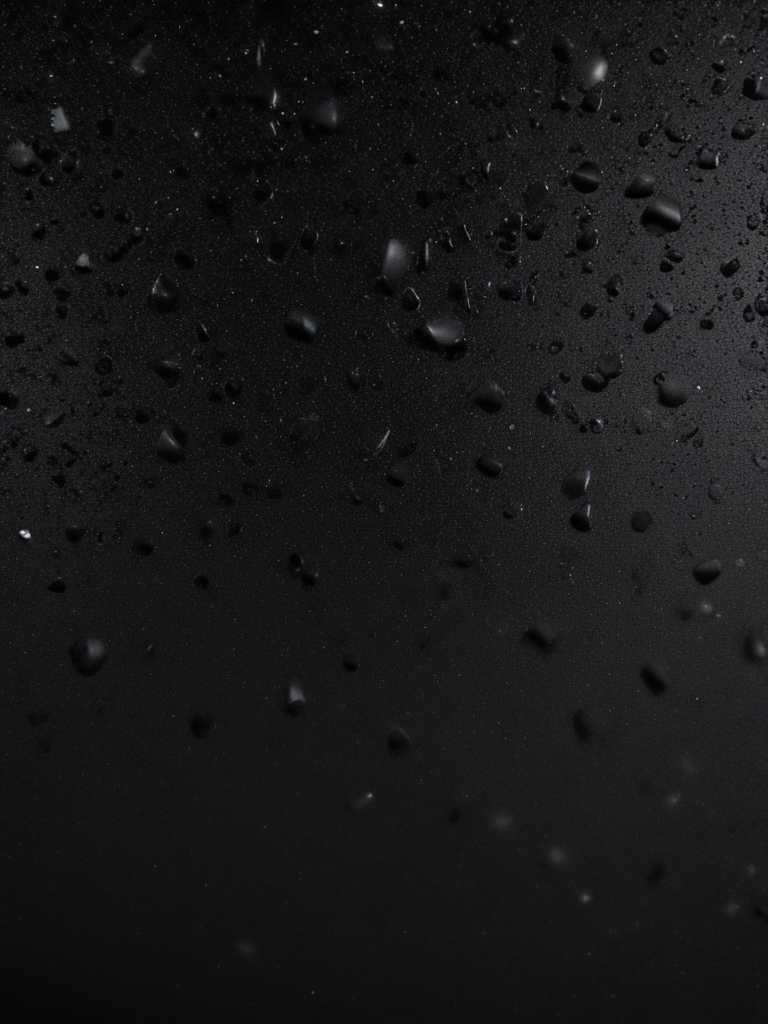 Close-Up of Water Droplets on a Dark Surface Against Black Background