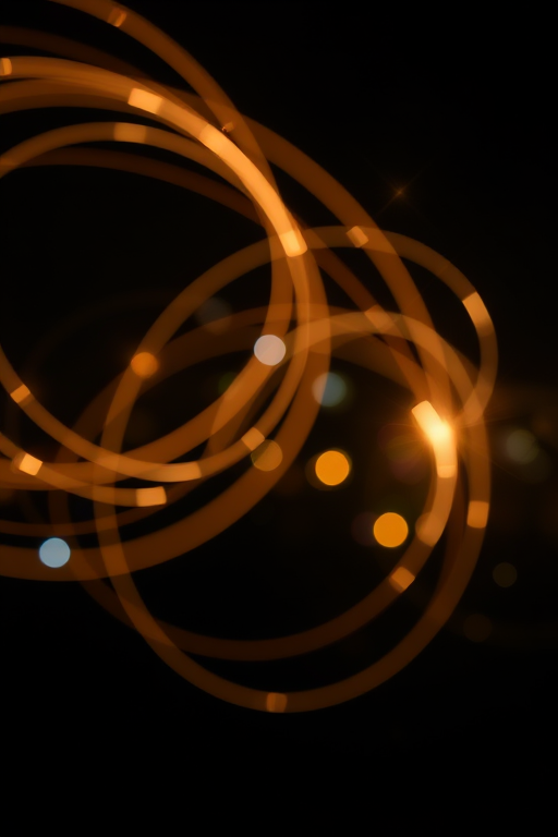 Create a high-resolution abstract image of swirling light trails with sparkling stars in a dark background using a DSLR camera, 50mm lens, f/1.8 aperture, ISO 100, shutter speed 1/125s, and a soft-focus effect for enhanced bokeh.
