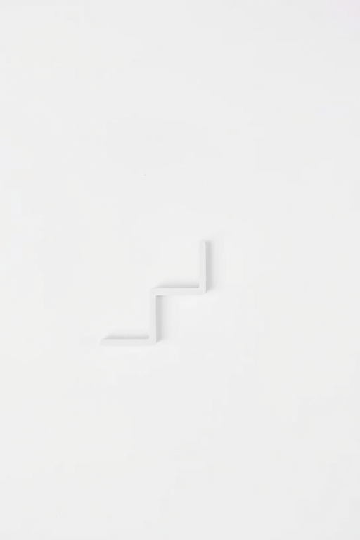 Generate a high-resolution image of a minimalist stair symbol on a plain background, using a DSLR camera with a 50mm lens at f/2.8, ISO 100, 1/200s shutter speed, shot from a direct overhead angle to enhance clarity and contrast.
