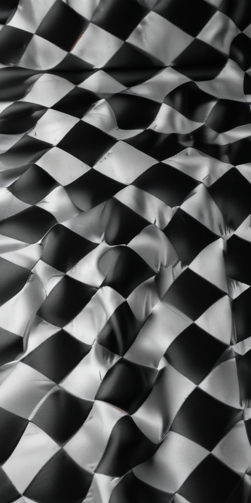 Abstract Close-Up of Crumpled Black and White Checkerboard Pattern Fabric