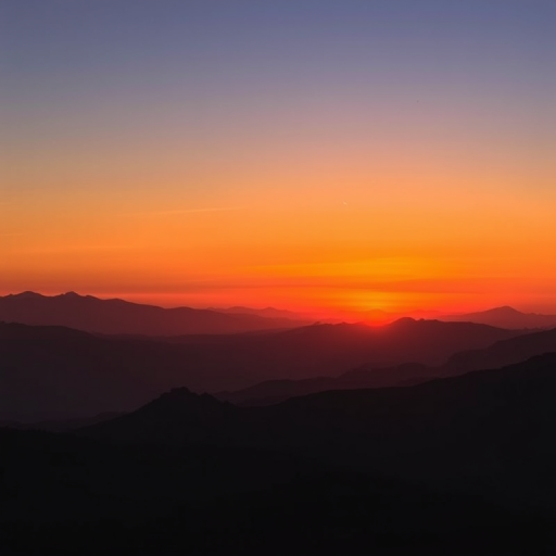 sunset over mountains with layered silhouettes in warm tones, captured with a DSLR camera at f/8 aperture, 1/125 sec shutter speed, ISO 100, wide-angle lens, landscape orientation, high dynamic range for enhanced depth and detail