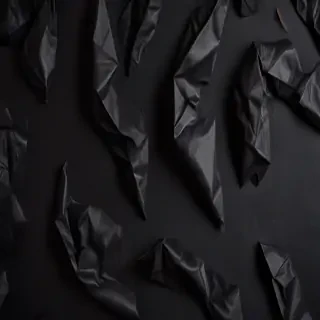 crumpled black paper