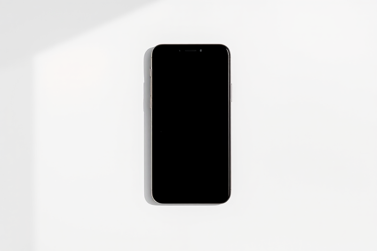 Generate a high-resolution image of a smartphone mockup on a plain background with a 50mm lens, f/1.8 aperture, ISO 100, shot in natural light using a DSLR camera from a slightly elevated angle.