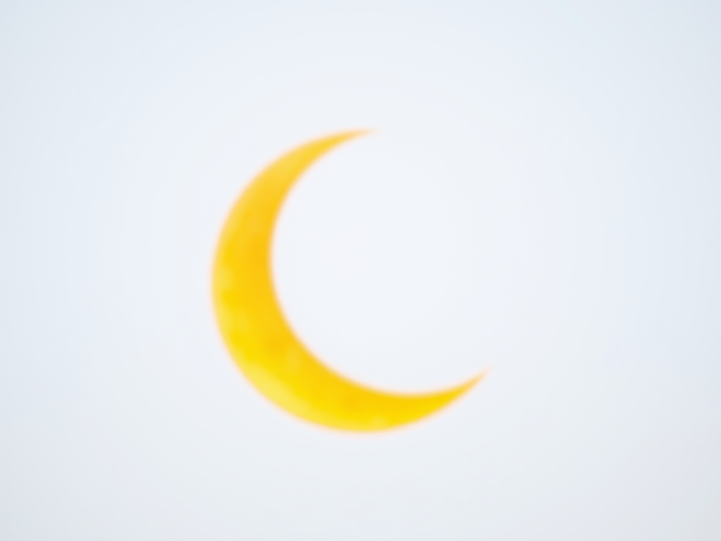 Create a vibrant yellow crescent moon on a white background with a soft focus, using a 50mm lens at f/1.8, ISO 100, and a shallow depth of field for a dreamy effect, shot in natural light with a mirrorless camera.