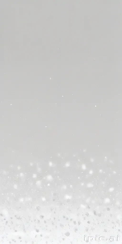 Delicate White Snowflakes Gently Falling Against a Soft Gray Background