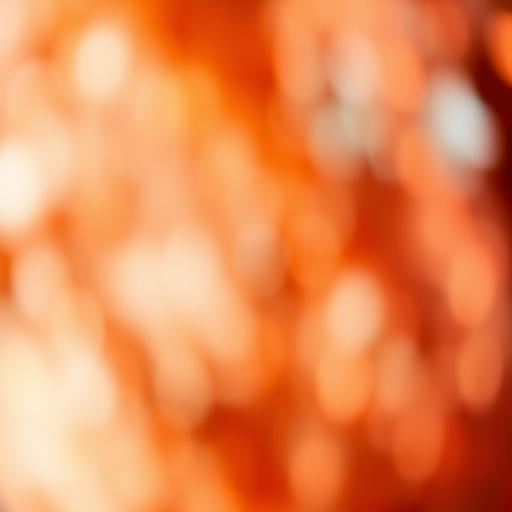 Create a soft focus abstract background with warm golden and red tones, using a DSLR camera with a 50mm lens, aperture f/1.8, shutter speed 1/60s, ISO 100, captured from a low-angle view to enhance depth and texture.