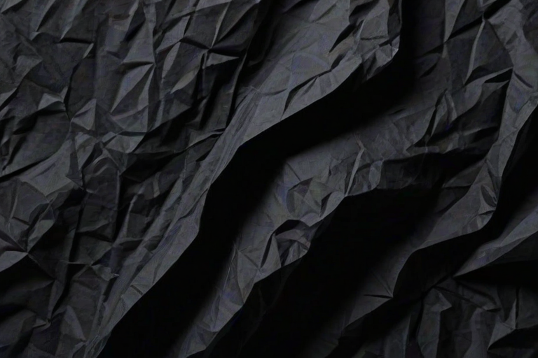 crinkled black paper