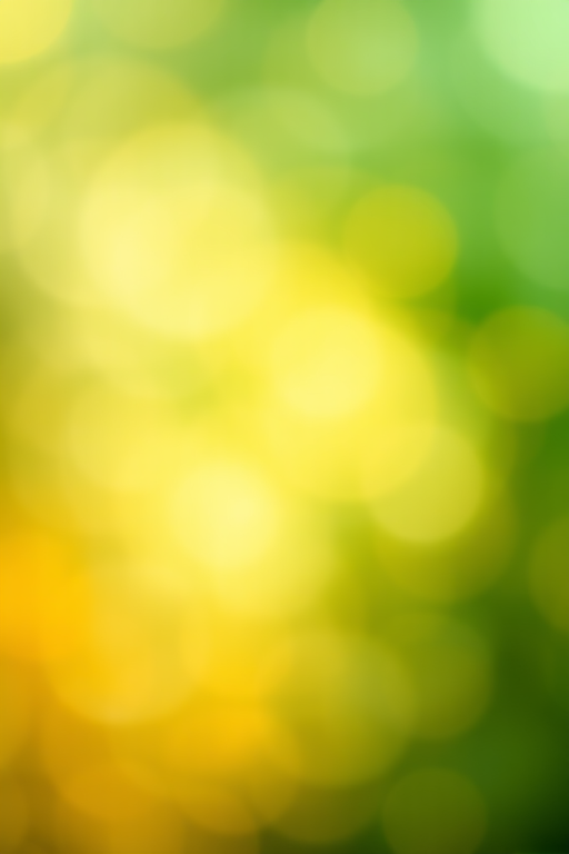 Create an abstract textured background with soft lighting, featuring blended colors of green, yellow, and orange, shot with a Canon EOS R5, 50mm lens, f/1.8, ISO 100, with a shallow depth of field and bokeh effect.