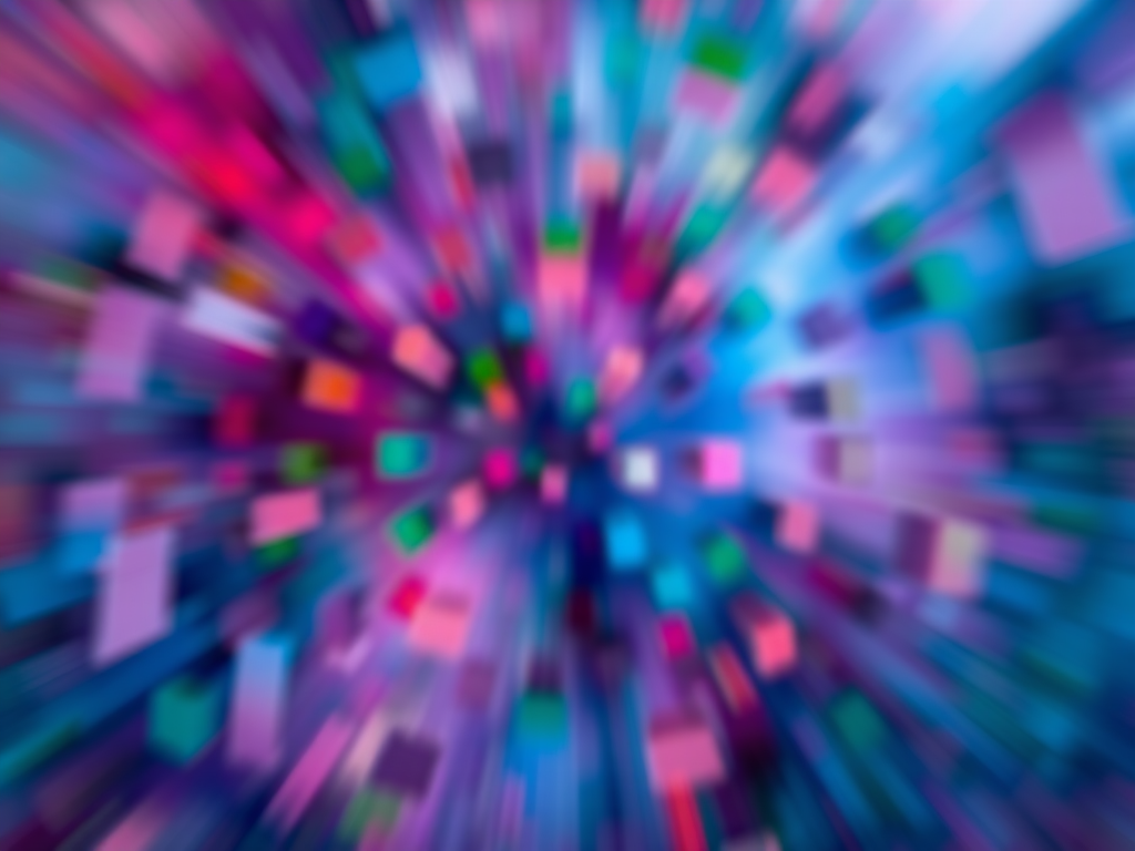 Create an abstract image with a vibrant mix of colors including red, blue, green, and purple, using a shallow depth of field, with ISO 200, aperture f/2.8, shutter speed 1/60s, shot from a top-down perspective with a DSLR camera in a high-resolution setting.