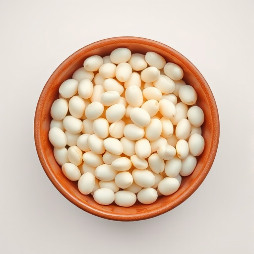 A high-quality image of a bowl filled with white beans on a clean, light background, captured with a DSLR camera at f/2.8, ISO 100, shutter speed 1/200s, using a 50mm lens, top-down view, natural lighting for enhanced detail and clarity.