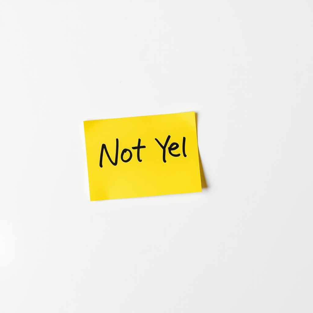 Generate an image of a bright yellow sticky note with the handwritten text "Not Yet" in bold black letters, using a Canon EOS 5D Mark IV camera, 50mm lens, f/2.8 aperture, ISO 100, natural light, and a clean white background for high contrast.