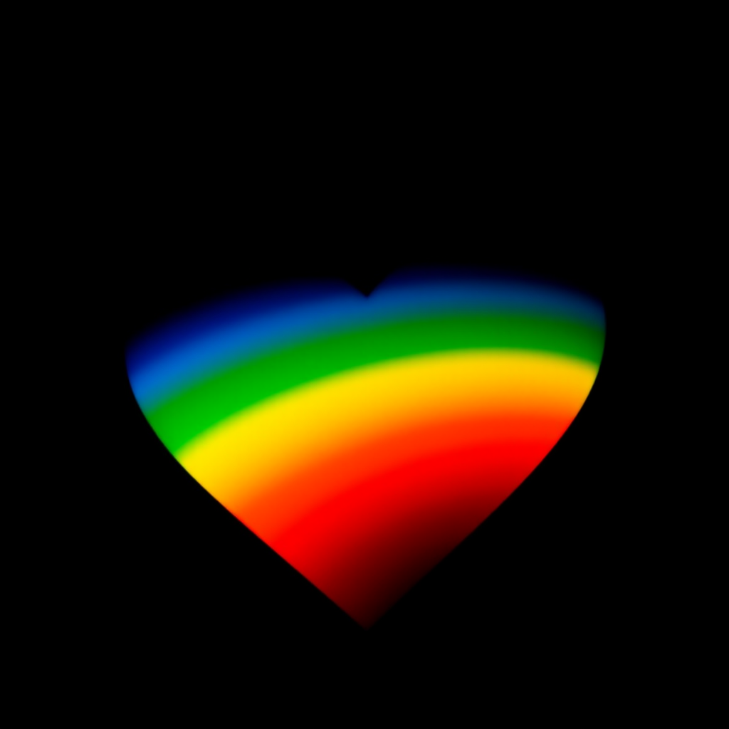 Create a vibrant rainbow heart on a black background using a DSLR camera with a 50mm lens at f/2.8, ISO 100, and a low angle view for enhanced detail and color saturation.