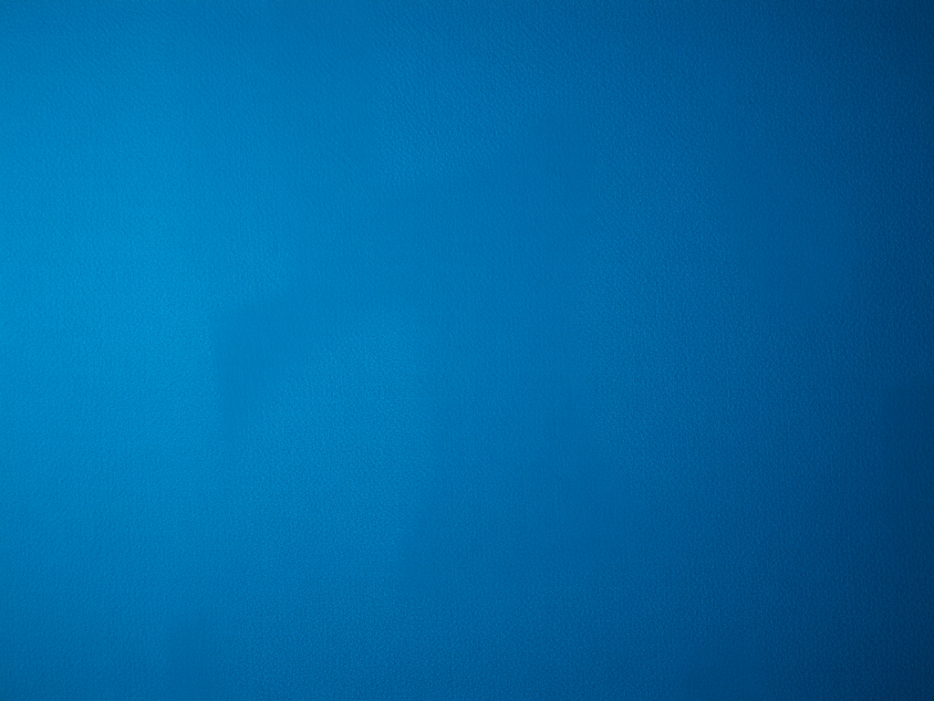 Create a deep blue textured background with high contrast, using a DSLR camera with a 50mm lens, aperture f/2.8, ISO 100, and soft lighting to enhance the details and depth.