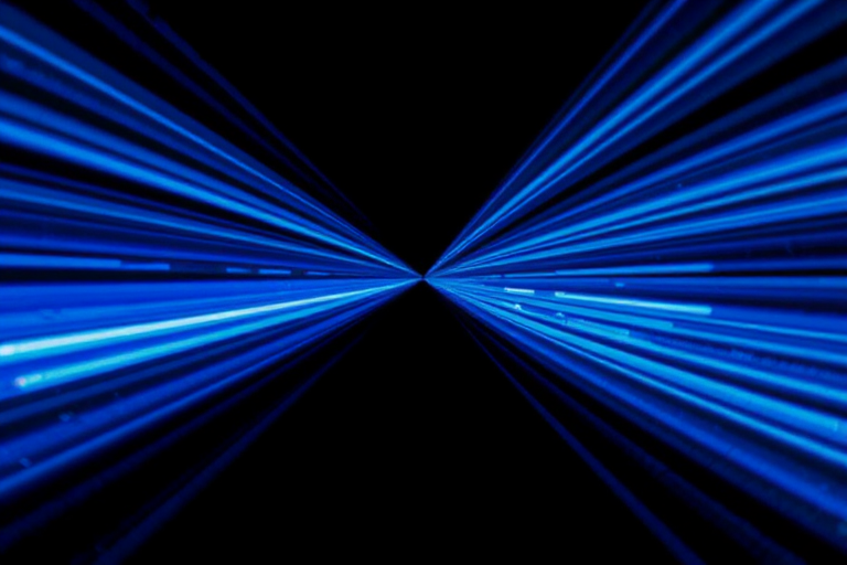 generate an abstract image of blue light rays radiating outward from a central point against a black background, using a DSLR camera set to f/8, ISO 100, 1/60s, shot in a wide-angle view with a high dynamic range to enhance depth and sharpness