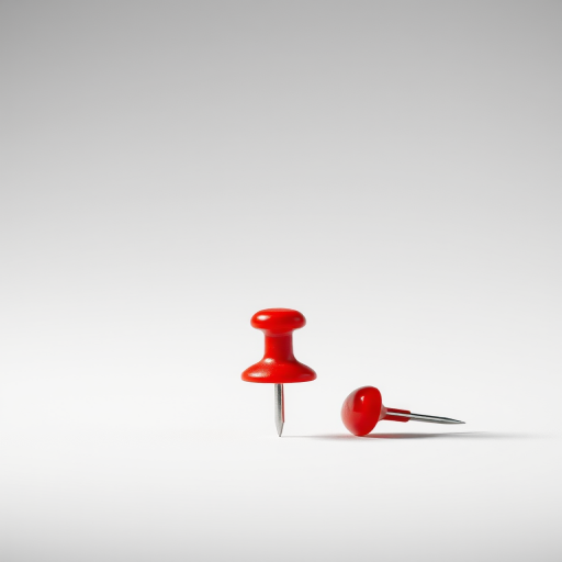Create a highly detailed, 3D-rendered image of a red pushpin on a white background, using a Canon EOS R5 camera, 50mm f/1.2 lens, aperture f/2.8, ISO 100, and a shallow depth of field to enhance focus on the pushpin.
