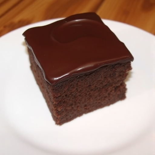 Chocolate cake with smooth chocolate frosting on top, square piece on a white plate, soft texture, rich dark color, simple presentation, appetizing and inviting.