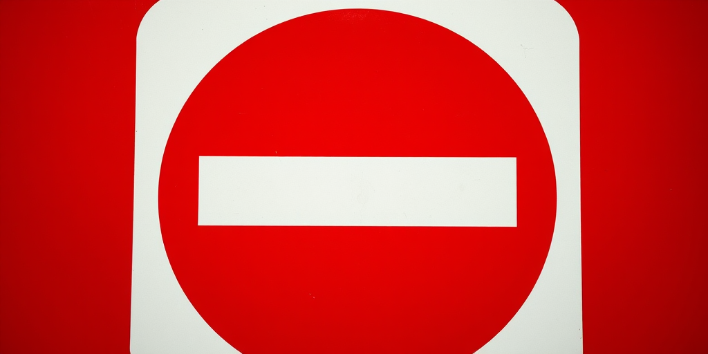Create an image of a no entry sign with a vibrant red background and a bold white horizontal rectangle in the center, captured using a DSLR camera with a 50mm lens, aperture set at f/2.8, shutter speed 1/200s, ISO 100, shot from a slightly low angle to enhance depth and clarity.