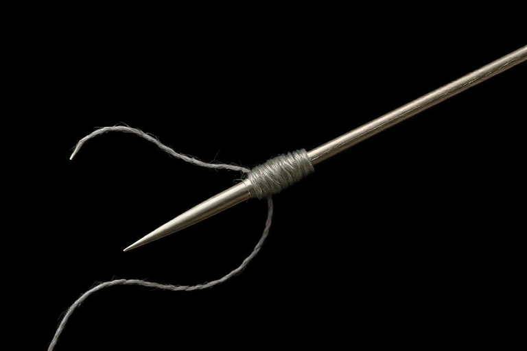 create a highly detailed illustration of a sewing needle and thread on a black background with sharp focus, f/2.8 aperture, 50mm lens, ISO 100, top-down view, digital art style