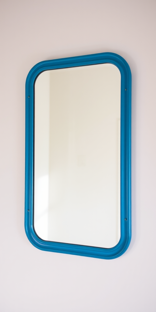 A clear wall-mounted mirror with a blue frame, photographed with a DSLR camera at f/5.6, ISO 100, 1/200 sec, in natural light, using a wide-angle lens from a straight-on view to capture the clean reflection and surrounding wall details.