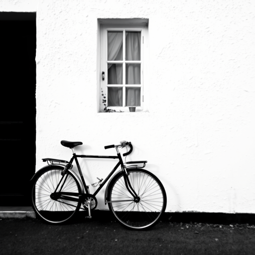 a vintage bicycle leaning against a textured white wall with a small window, black and white, 50mm lens, f/2.8 aperture, ISO 100, natural light, shallow depth of field, DSLR camera