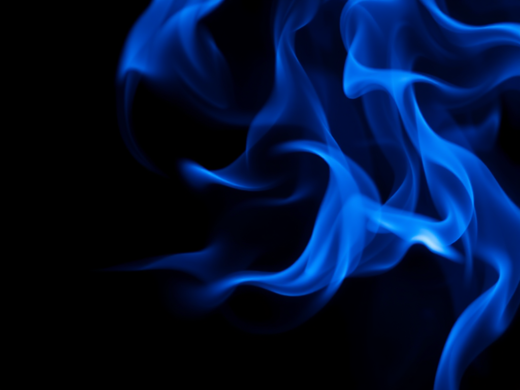 high-resolution image of swirling blue flames on a dark background, shot with a Canon EOS R5 camera, 50mm focal length, aperture f/1.8, ISO 100, shutter speed 1/200s, in a macro lens style for enhanced detail and texture.