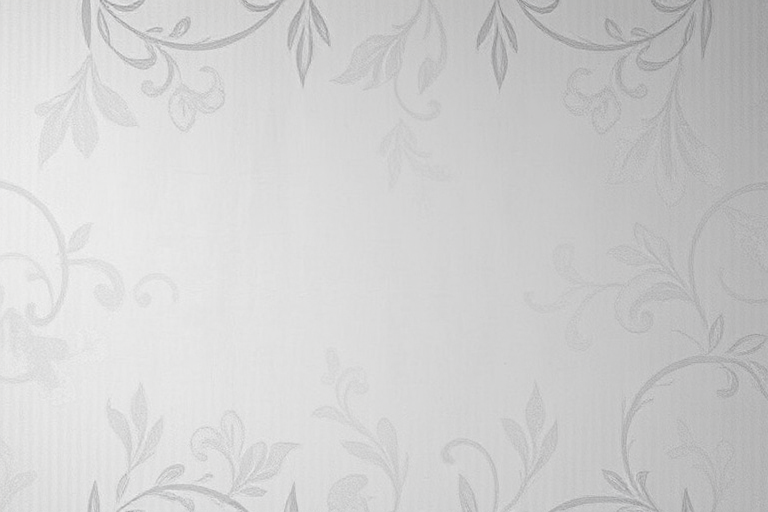 Generate a high-resolution image of a light gray textured wall with an elegant floral pattern, centered with a smooth rectangular space for text, captured with a DSLR camera at f/2.8 aperture, ISO 100, 50mm lens, overhead view, soft focus style.