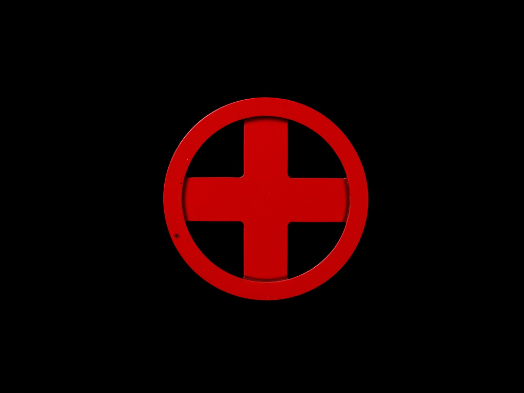 Create a high-resolution image of a red circular cross symbol on a black background captured with a Canon EOS R5 at f/8, ISO 100, 1/125s, front view, using a macro lens for detail enhancement.