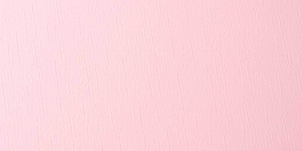 Create a high-resolution image of a soft pink textured background, with a shallow depth of field, using a DSLR camera with a 50mm lens, aperture set to f/1.8, ISO 100, and natural soft lighting to enhance the texture details.