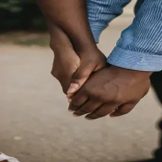 black couple holding hands