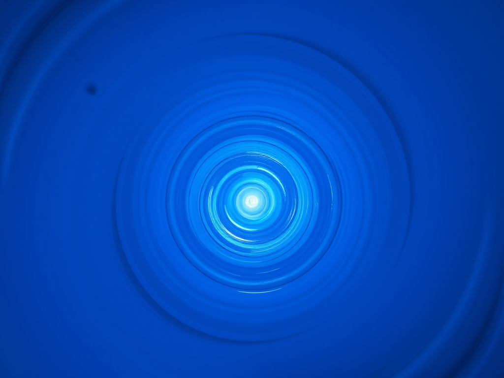 create a vibrant blue spiral tunnel with a high level of detail, shot using a DSLR camera at f/8 aperture, ISO 100, 1/60 sec shutter speed, wide-angle lens, maintain a symmetrical perspective to enhance depth.