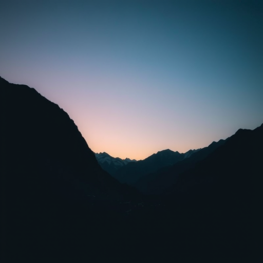 Generate a serene landscape featuring mountains with a gradient sky transitioning from dark to light turquoise, using a DSLR camera set to ISO 100, aperture f/8, shutter speed 1/200s, wide-angle lens, shot from a low angle to emphasize the foreground.