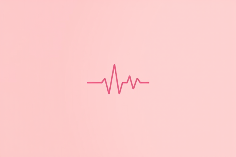 Create a minimalist heart icon with a heartbeat line inside, using a soft pastel color palette, with a camera view of 50mm, aperture set to f/2.8, and a shallow depth of field for a clean background, shot using a DSLR camera in natural lighting.