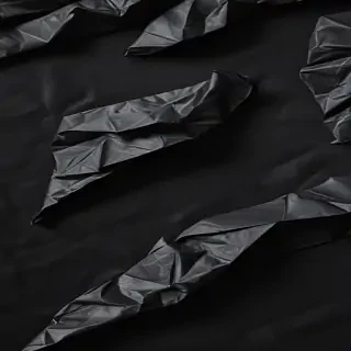 crumpled black paper