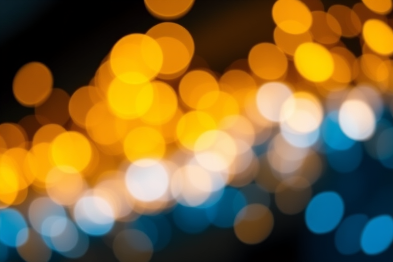 create a vibrant bokeh background with golden and blue light particles softly illuminated, using a DSLR camera, f/2.8 aperture, 50mm lens, in a close-up view, at ISO 200 for enhanced clarity and depth.