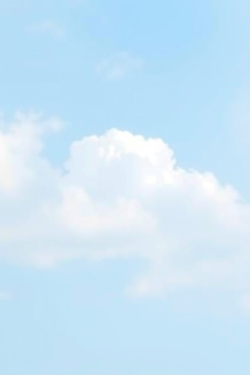 Create a digital artwork of a stylized cloudy sky with soft, blurred clouds against a light blue background, incorporating smooth gradient layers and a serene atmosphere, using a DSLR camera with a 50mm lens at f/4, ISO 100, and a shallow depth of field for a soft focus effect.
