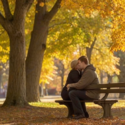 Warmly lit image of a couple sharing a quiet moment on a park bench, surrounded by falling autumn leaves, with a gentle breeze blowing through the colorful foliage.