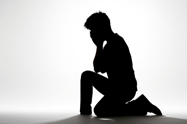 Generate a high-contrast silhouette of a person kneeling with hands on their face against a white background using a Canon EOS R5 camera with a 50mm f/1.2 lens, aperture set to f/2.8, ISO 100, and a shallow depth of field to enhance image quality.