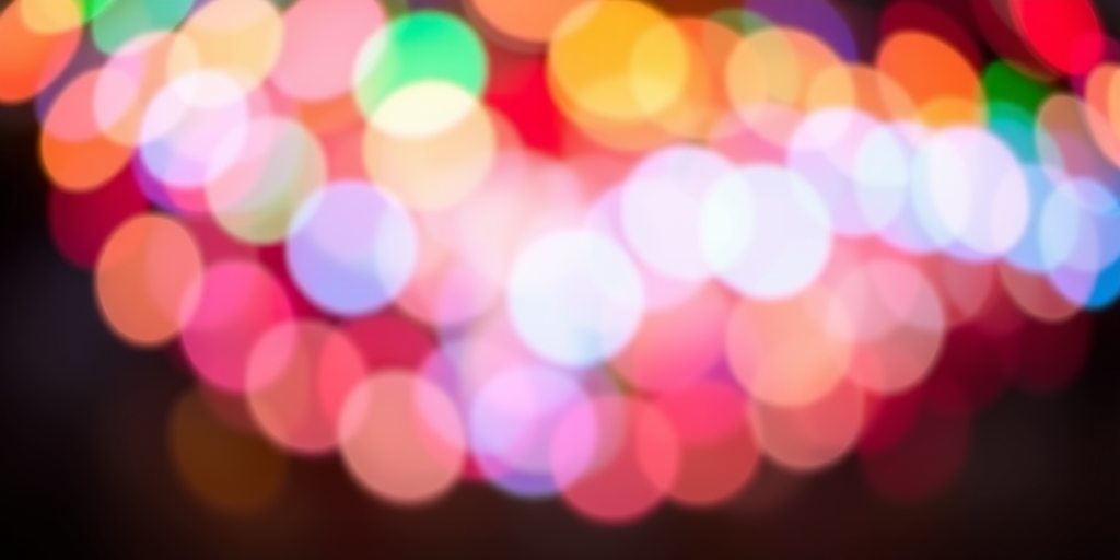 create a vibrant abstract swirl of colorful bokeh lights with a shallow depth of field, shot with a DSLR camera at f/1.8 aperture, 50mm lens, ISO 100, in a circular pattern, using a macro lens for enhanced detail and sharpness