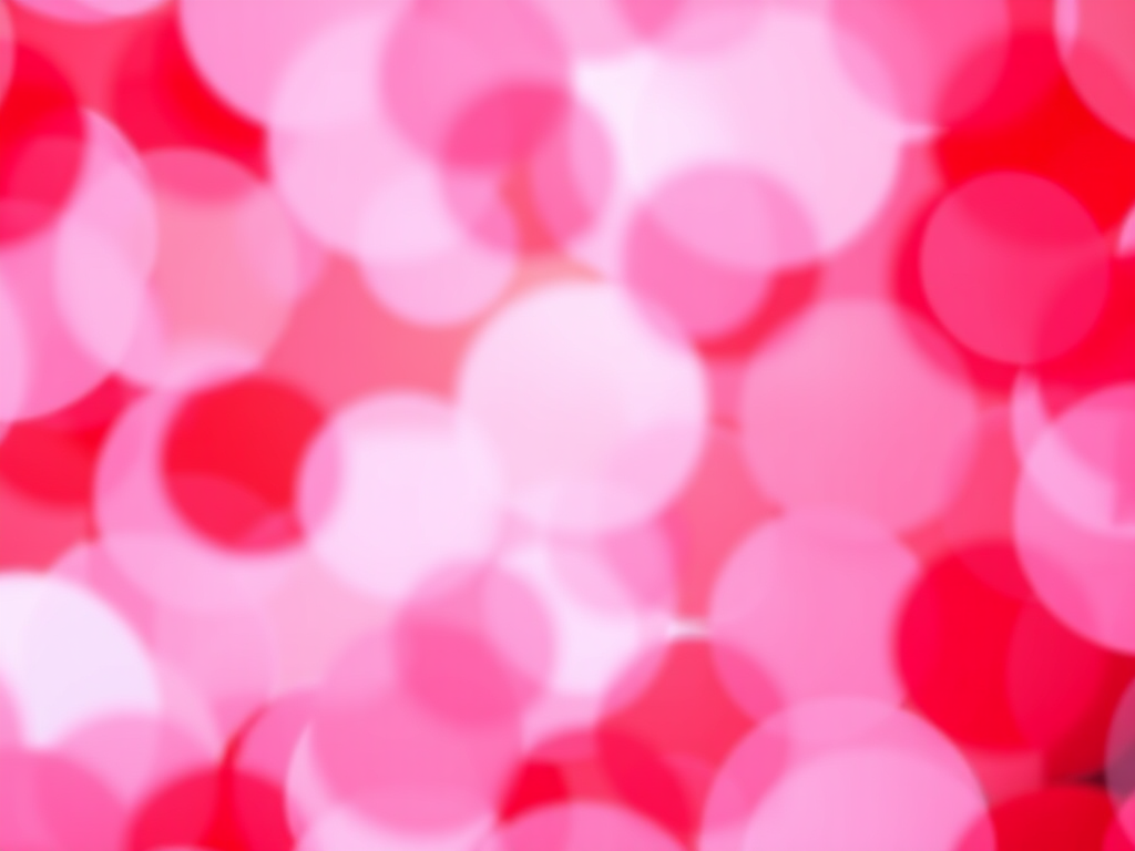 Create a vibrant abstract background with overlapping circles in various shades of red and pink, using a DSLR camera at f/2.8 aperture, ISO 100, and a 50mm lens to capture a bokeh effect, in a soft focus style.
