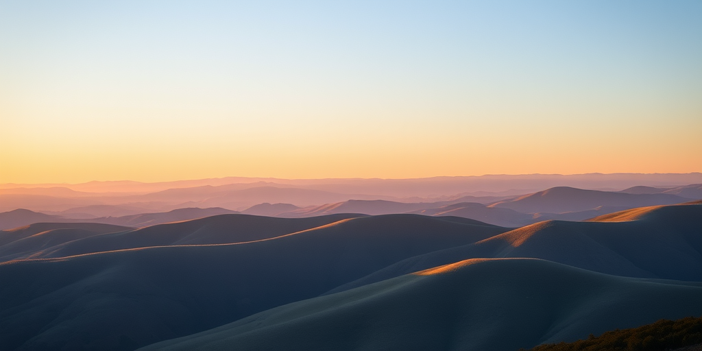 Create a high-resolution image of a serene landscape with rolling hills under a clear blue sky during golden hour, using a Canon EOS R5 with a 24-70mm f/2.8 lens at f/8, ISO 100, shutter speed 1/125s, with a wide-angle view to capture depth and vibrant colors.