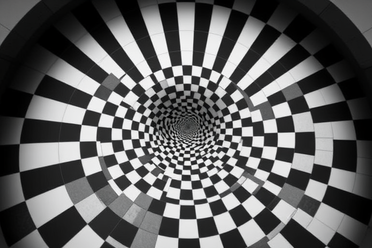 Create a high-resolution image of a black and white checkerboard pattern spiraling inward, using a 50mm lens at f/8 aperture, shot from a top-down perspective with a digital DSLR camera, ensuring sharp details and high contrast.
