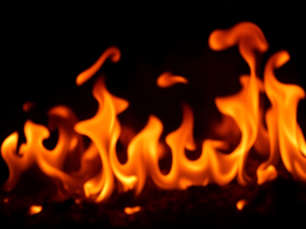 high-resolution image of vibrant flames on a dark background, using a Canon EOS 5D Mark IV, 50mm lens, f/1.8 aperture, ISO 100, 1/200 sec shutter speed, shot in soft focus with a shallow depth of field to enhance the details of the fire.