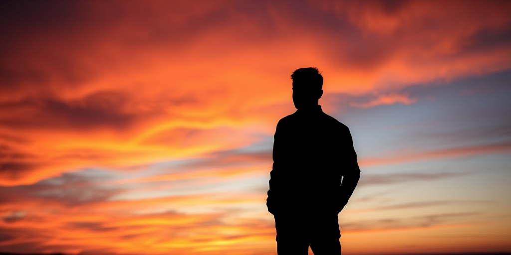 Generate a high-quality image of a silhouette of a person standing against a vibrant sunset background with a DSLR camera, 50mm lens, aperture f/1.8, ISO 100, shutter speed 1/200s, capturing a dramatic sky in landscape orientation.