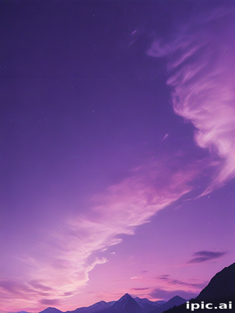 Majestic Purple Sky at Dusk Over Snow-Capped Mountains and Clouds