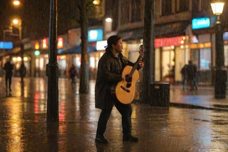 Blurry candid shot of a street performer playing a guitar on a rainy evening, soft golden light from nearby streetlamps reflecting off the wet pavement, with distant passersby huddled under umbrellas.