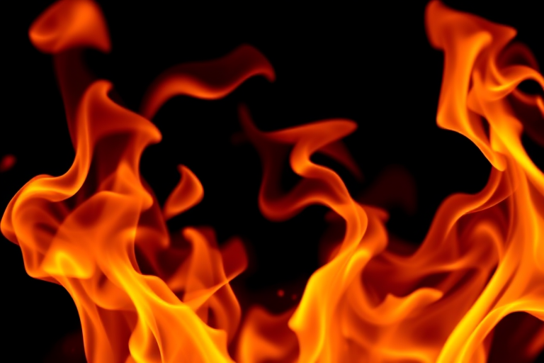 Generate an abstract image of swirling flames against a black background, using a DSLR camera with a 50mm lens, f/2.8 aperture, ISO 100, and a low-angle view to enhance depth, capturing the vibrant colors and dynamic motion in high resolution.